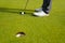 Man playing golf on a golf course in the sun, Golfers hit sweeping golf course in the summer