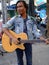 Man playing guitar, Bangkok, Thailand.