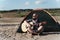 Man playing guitar while camping in desert