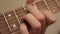 Man playing the guitar. fingers fingering the chords