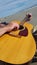 Man playing guitar by the sea