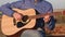 Man playing guitar with slow motion shoot music musician classic chord acoustic. Use for illustration or insert