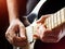 Man playing guitar on a stage. Musical concert