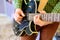 Man playing guitar on a stage. Musical concert. Close-up view