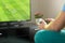Man playing imaginary soccer or football console game on tv.
