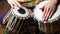 Man playing on Indian tabla drums