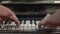 Man playing piano by both hands. Musician. Talent. Melody. Black and white keys.