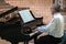 Man playing piano in a cathedral