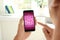 Man playing sudoku game on smartphone indoors, closeup