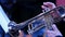 Man playing the trumpet in concert. Close up of a male hands. Musician of a brass band.