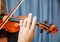 Man playing the violin. hands closeup