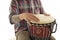 Man plays ethnic drum darbuka percussion, close up musician isolated on white studio background