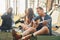 Man plays guitar. Group of young people is traveling together in the forest at daytime