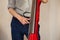 Man plays red electric contrabass