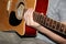 Man plays a six-stringed wooden guitar, musical concept, close-up