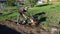 A man plowing a field cultivator, land