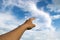 Man pointing his hand and cloud sky background