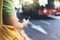 Man pointing on screen smartphone on background red bus, tourist hipster waiting taxi and using in hands mobile phone, traveler