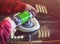 A man polishes a car with a close-up grinder.