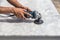 Man polishing marble table by angle grinder