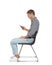 Man with poor posture using smartphone while sitting on chair