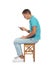 Man with poor posture using smartphone while sitting on stool