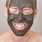 Man portait with face mask. Smiling emotion