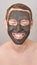 Man portait with face mask. Smiling emotion