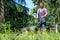 Man portrait mowing the lawn with lawnmower