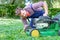 Man portrait mowing the lawn with lawnmower