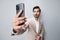 man portrait suit phone space smartphone hold copy smile happy business call