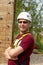 Man is posing before climbing wall