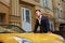 Man posing with convertible sportcar