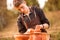 Man potter work with clay ware. Young man potter on his workshop with nature background