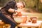 Man potter work with clay ware. Young man potter on his workshop with nature background