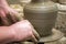 Man potter at work creating some traditional cups of white clay, Lassithi, Crete, Greece.