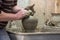 Man potter at work creating some traditional cups of white clay, Lassithi, Crete, Greece.