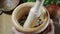 Man pounding spices in a mortar