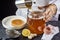 Man pouring a brew of sweetened black tea