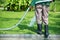 Man pouring grass in the park