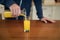 Man pouring juice in the glass in the kitchen