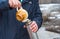 Man pouring tea into a thermos