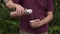 Man pouring tea from thermos into cup