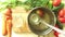 Man pours chicken broth in a glass jar