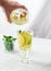 Man pours glass detox water cucumber lemon mint