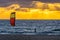 A man that practice kitesurf during in a sunset in tarifa, Spain