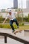 Man Practices Skateboard Trick On Railing