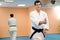 Man practicing aikido, sports health care. Black belt