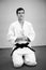 Man practicing aikido, sports health care. Black belt