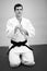 Man practicing aikido, sports health care. Black belt